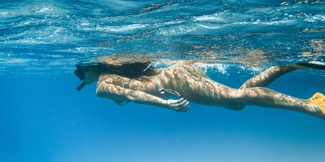 person snorkeling in Bahamas
